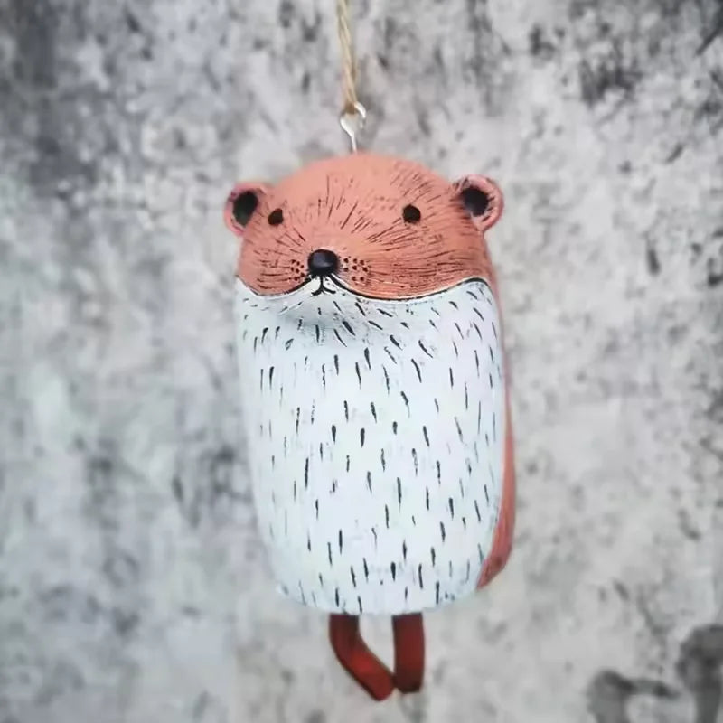 cloches décoratives animaux ours renard hibou motifs poils plumes artisanal extérieur
