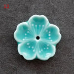 support bâtonnets encens fleurs stylisées artisanal rose bleu vert jaune blanc