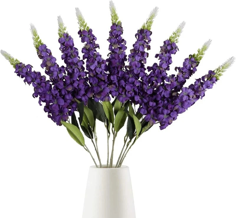 décoration intérieure bouquet artificiel moderne élégant vase livres bougies anniversaire mariage baby shower