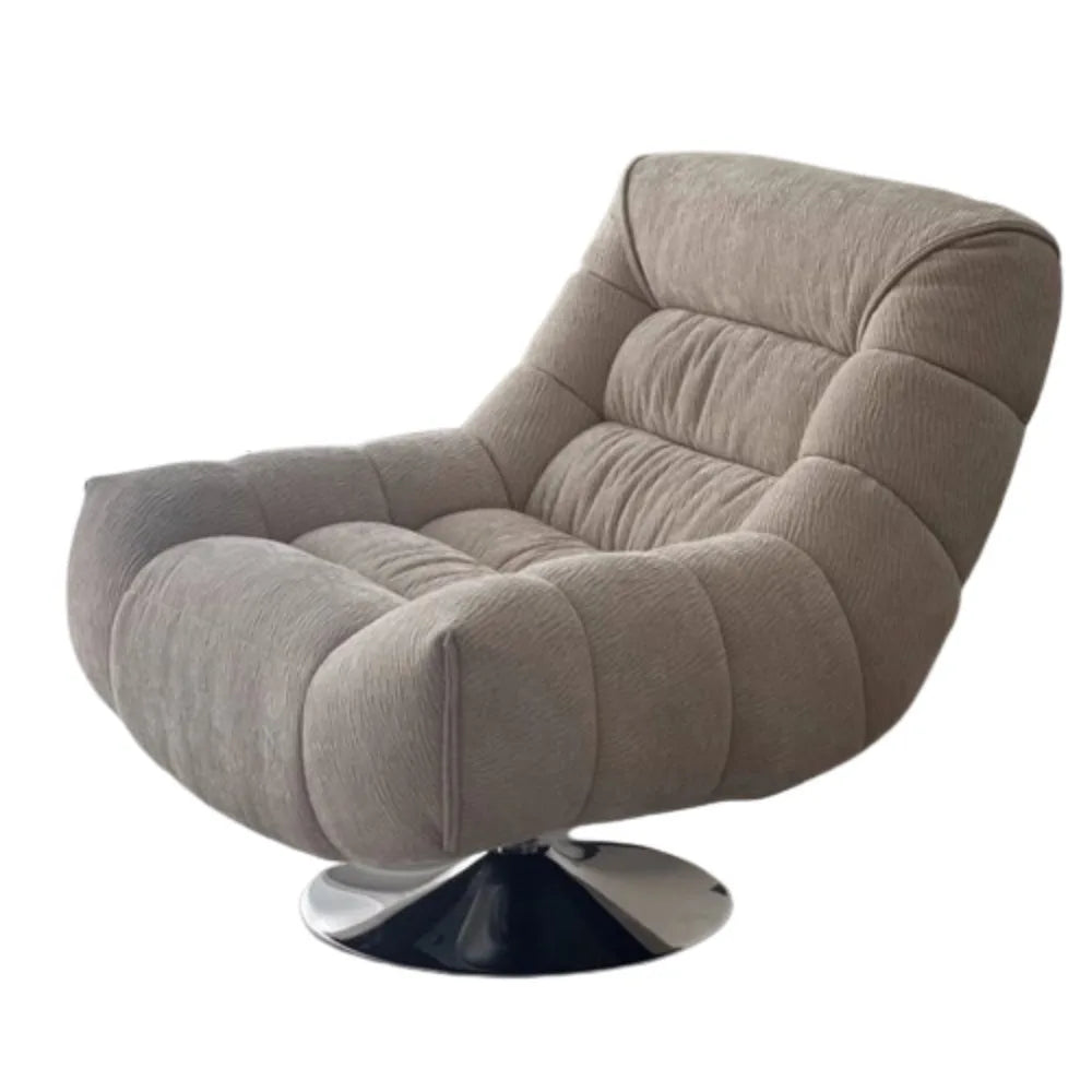 fauteuil pivotant moderne rose velours côtelé intérieur coussin décoratif livres vase fleurs