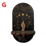 étagère murale noire dorée ornementations astrologiques pendeloques semi précieuses artisanal