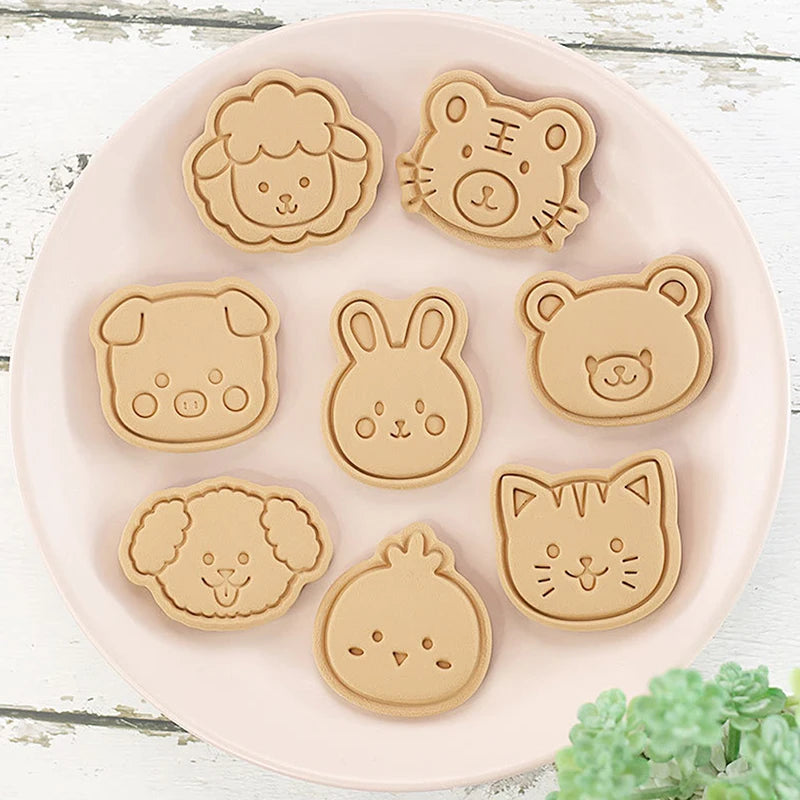 outils pâtisserie emporte pièces biscuits animaux dessin animé cartoon orange vert rose beige
