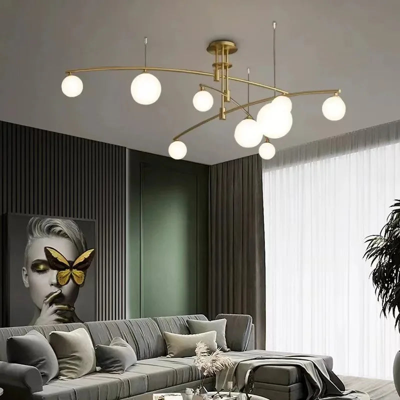 luminaire suspension moderne sphères translucides structure métallique dorée éclairage salon salle manger chambre
