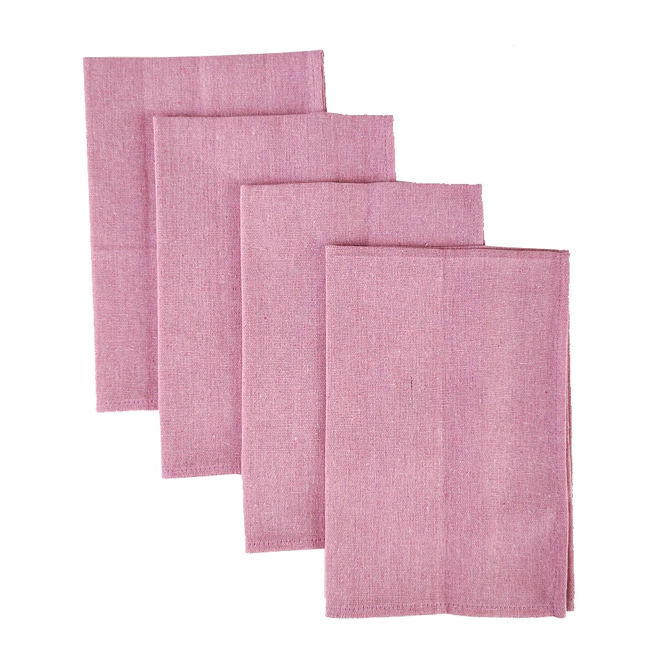 Serviettes de table simples en lin rose pâle pour un décor élégant et minimaliste.