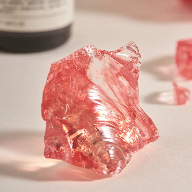 pierres quartz rose flacon parfum or argent élégant décor photo fond background prop transparent