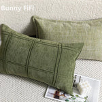 coussin vert olive rayures moderne décoration intérieure blanc motif géométrique noir plissé