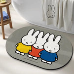 tapis bain dessin animé lapins gris jaune vert bleu rayures enfantin absorbant