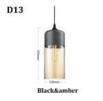 suspension lumineuse moderne pendentif verre noir transparent contemporain fixation câble luminaire salle manger chambre