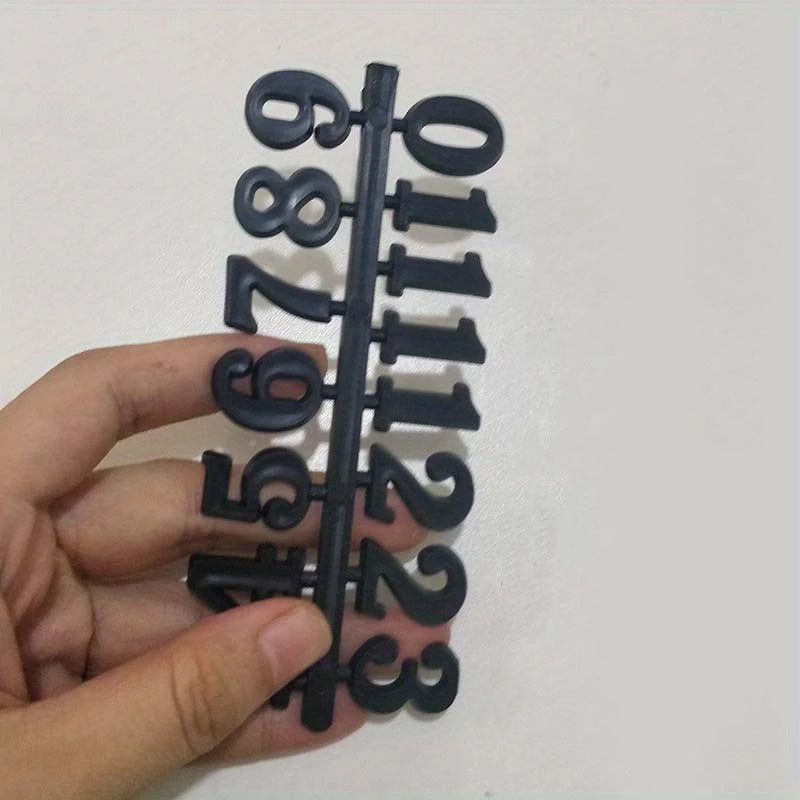 horloge murale moderne or noir argent numéros romains arabes vis fixations