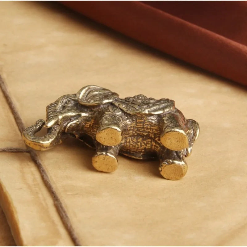 statuette éléphant bronze doré texture peau éléphant motifs floraux traditionnel asiatique décoration maison salon