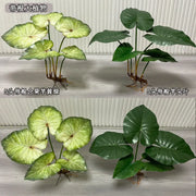 plantes artificielles feuilles vertes motif blancs décoration murale extérieure jardin tropical