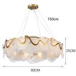 suspension lumineuse moderne transparente dorée ronds ondulés élégante chaînes suspendues ampoules métal