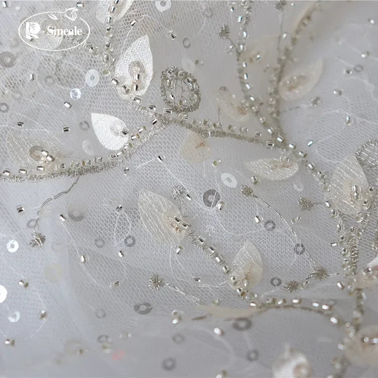 tissu dentelle feuilles brodé élégant polyester translucide blanc argent materiaux couture robes mariage