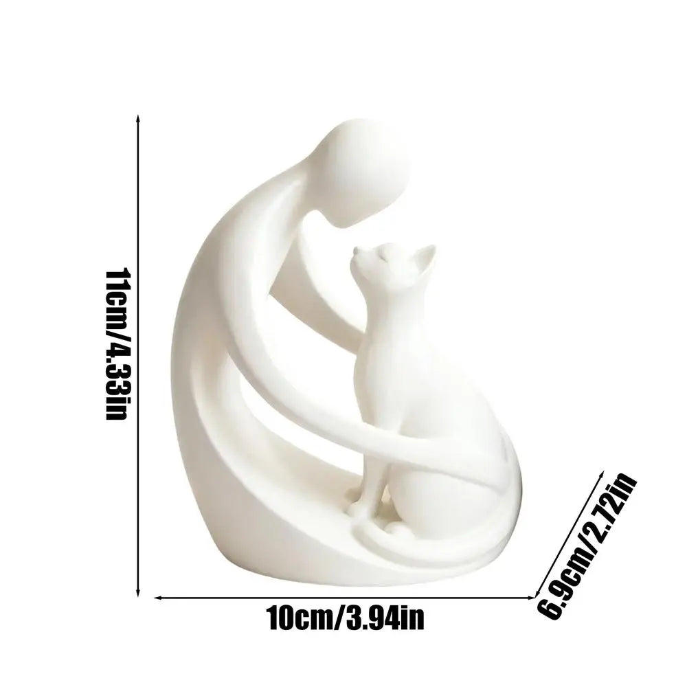 statuette moderne personne chat blanc noir stylisée abstraiteDecoration intérieure livre plante verte bougie chandelle
