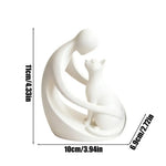 statuette moderne personne chat blanc noir stylisée abstraiteDecoration intérieure livre plante verte bougie chandelle