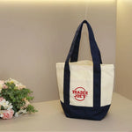 sac main réutilisable toile orange violet noir vert moderne poignées détachables étiquette logo sac