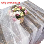 nappe tulle blanche semi transparente élégante mariage festif decoration table fleurs artificielles bougies gateau