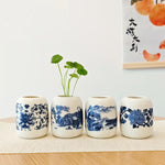 vase céramique blanc bleu fleurs stylisées artisanal traditionnel décoration intérieure pot fleurs