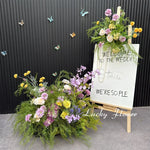 décoration murale naturelle composition florale variée couleurs vives rustique bienvenue mariage