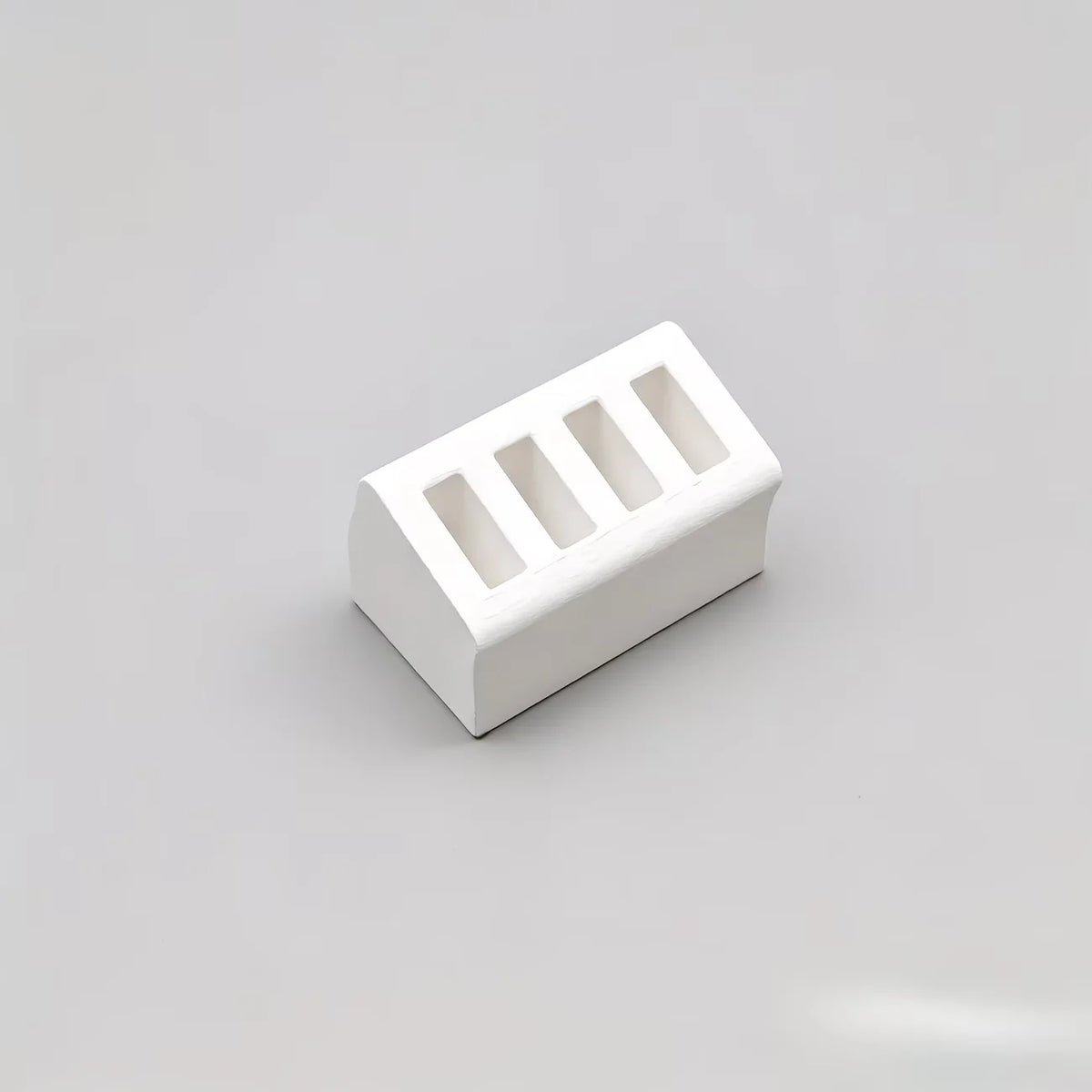 support chargeur moderne réutilisable plastique beige clair quatre fentes opaques objets divers respectueux environnement