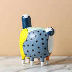 figurines decoratives modernes enfants couleurs vives motifs points textures lisses deco maison exposition