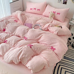Housse de couette rose avec motif noeud papillon