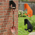 support mural industriel noir orange outils jardin vis cheville fixations robustes tronçonneuse pelles multifonctionnels