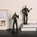 statue musicien moderne abstraite saxophone guitare noire décoration intérieure couple instrumental résine opaque base