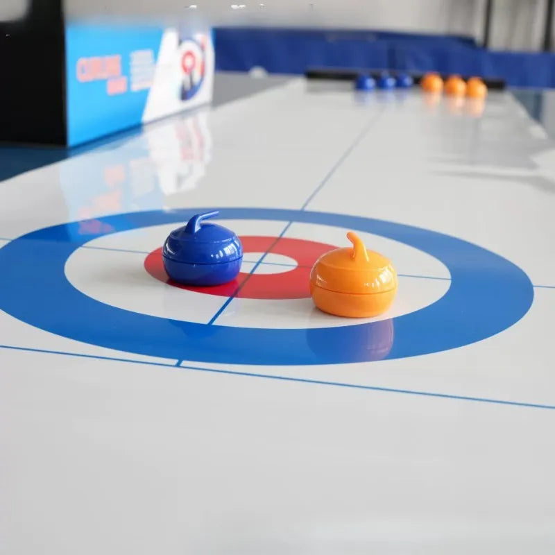 jeu curling table société familiale pierres bleu rouge blanc plateau concentrique sportifs