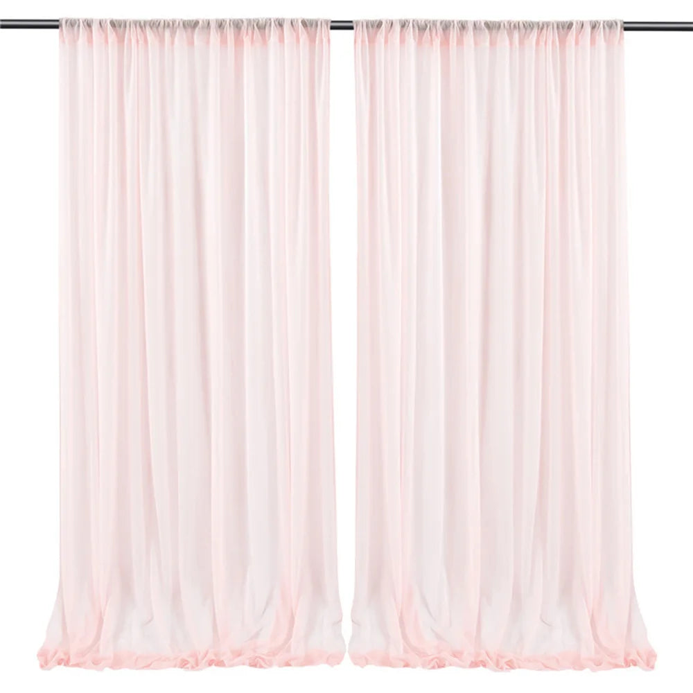 Paire de rideaux longs et légers dans une couleur rose pastel, parfaits pour embellir une pièce avec une touche douce et élégante.
