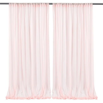 Paire de rideaux longs et légers dans une couleur rose pastel, parfaits pour embellir une pièce avec une touche douce et élégante.