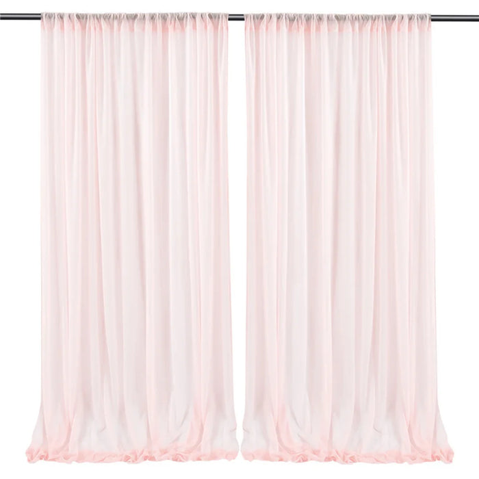Paire de rideaux longs et légers dans une couleur rose pastel, parfaits pour embellir une pièce avec une touche douce et élégante.