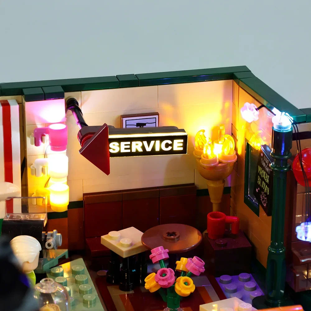 maquette lego détaillée adhésif lumineuse couleurs vives canapé bar étagères affiches