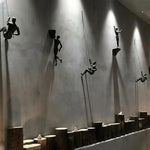 statues escalade homme résine noires texture rugueuse détail anatomique réaliste fixées