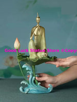 statue bouddha dorée art deco détails sculptés base vague lotus chambre