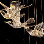 suspension lumineuse oiseaux transparente moderne contemporain lumière blanche salle manger chambre salon