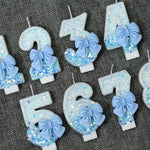 bougies anniversaire chiffres blanc bleu paillettes argentées festives tringle decoration