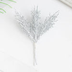 décoration noël plumes artificielles branches feuilles pin pommes coton rouges traditionnellements