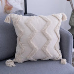 coussins décoratifs bohèmes motifs géométriques blanc cassé franges dentelle