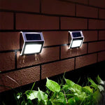 lampe solaire murale extérieure led moderne argentée noire blanche adhésive jardin patio