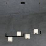 suspension lumineuse moderne marbre noir blanc or rose fixée câbles chambre salon