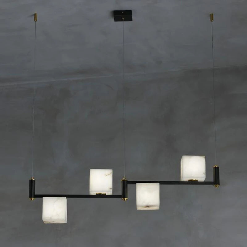 suspension lumineuse moderne marbre noir blanc or rose fixée câbles chambre salon