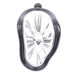 horloges murales surréalistes dali or noir argent chiffres romains aiguilles forme organique transparentes salon