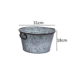 seau métal vintage anses rouille plante verte fleur blanche pot terre cuite brique rouge