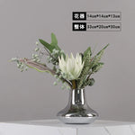 vase moderne argenté brillant fleurs artificielles blanches vertes décoration maison