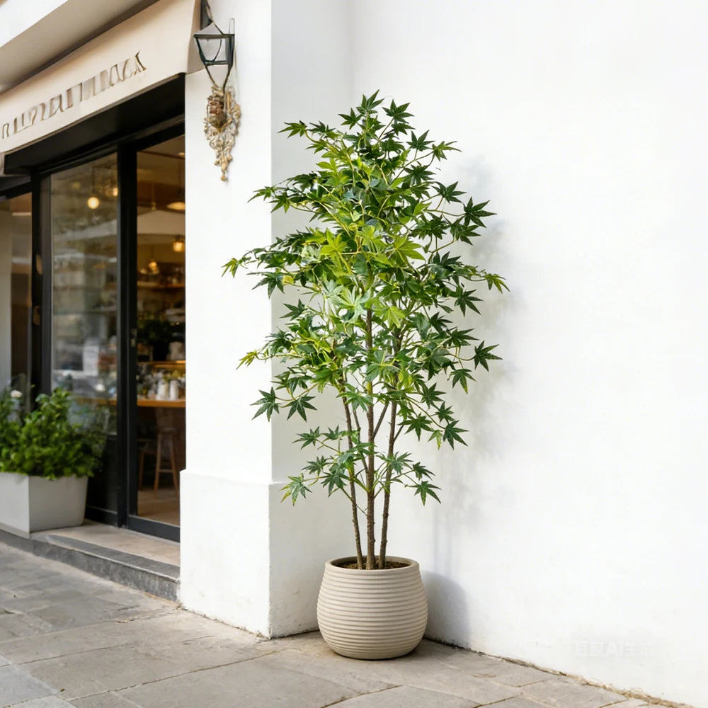 plante artificielle arbuste feuilles vertes feuilles pointues tronc droit pot beige décoration intérieure moderne