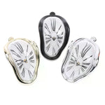 horloges murales surréalistes dali or noir argent chiffres romains aiguilles forme organique transparentes salon