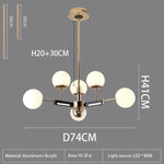 suspension lumineuse moderne or noir blanc sphères translucides structure métallique fixée lumière led