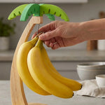 support fruits bois clair feuilles vert bananes citrons raisins pommes oranges tasse vertical comptoir