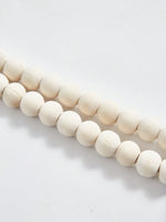 rideau boho chic arc ciel blanc pompons fenêtre maison hospitalité